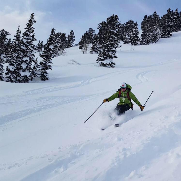 Pictured: A SAR rescuer practicing safe backcountry ski techniques – and having fun! 